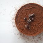 Cacao powder with chocolate nibs on top